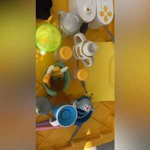 Bunch of baby items cups and bottles and much more